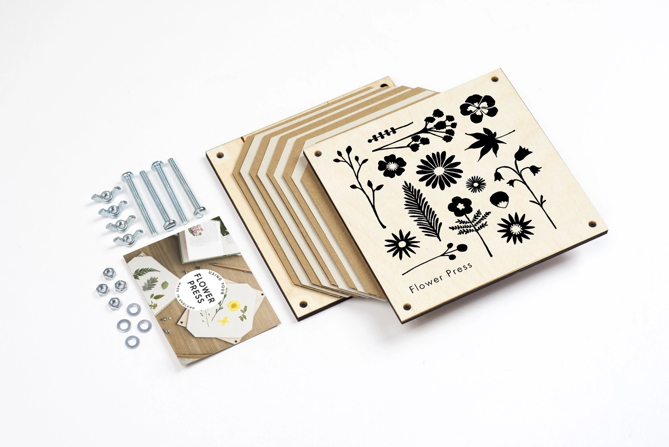 Wooden flower press for preserving flowers and leaves, inspired by botanical collecting and nature-based creativity.