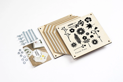 Wooden flower press for preserving flowers and leaves, inspired by botanical collecting and nature-based creativity.